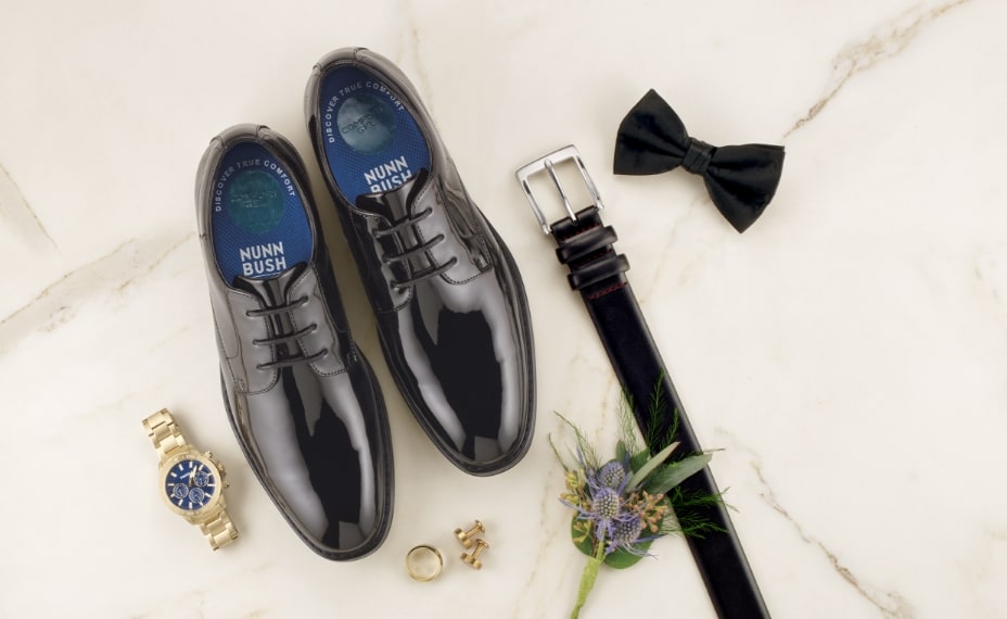 Shop Nunn Bush wedding picks. Image features the Centro Formal Flex in a flat lay with accessories. 